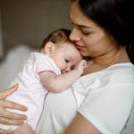 Mother holding baby.