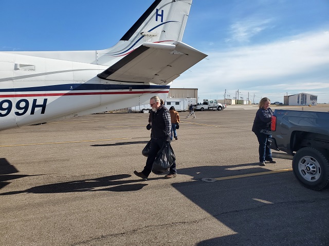 Bag of baits being loaded on to aircraft