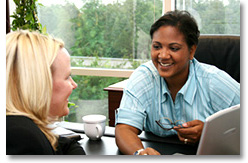 Health Care Provider talking to a woman.